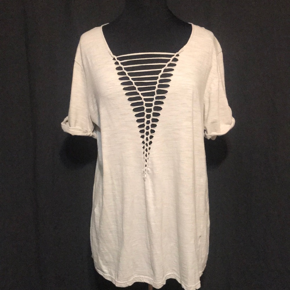 Cream colored deep v neck ripped top